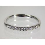 A 9ct white gold ring set with 0.25ct diamonds siz