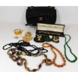A set of amber style beads & other costume jewelle