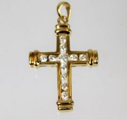 A 14ct gold cross pendant set with 0.35ct diamond