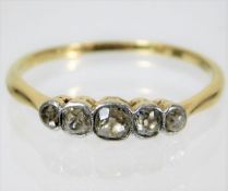 An antique yellow metal ring, tests as 18ct gold,
