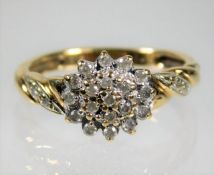 A 9ct gold cluster ring set with small diamonds si