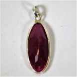 A silver mounted ruby stone pendant