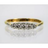 An 18ct gold ring with platinum set diamonds size