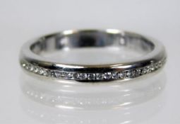 An 18ct white gold half eternity ring set with dia