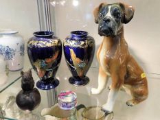 A boxer dog puppy figure, two decorative vases, a