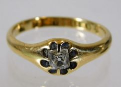 An 18ct gold antique ring set with cushion style c