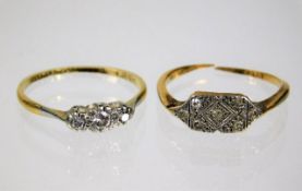 A small 18ct gold trilogy ring with platinum set d