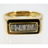 An 18ct gold ring set with baguette diamonds size
