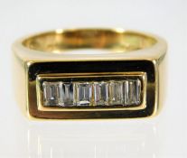 An 18ct gold ring set with baguette diamonds size