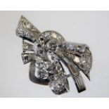 An art deco white metal dress clip set with baguet