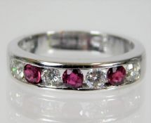 An 18ct white gold ring set with ruby & approx. 0.
