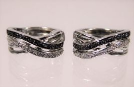 A pair of silver black & white diamond earrings 6g