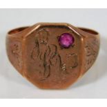 An antique rose coloured metal ring set with garne