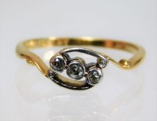 An art deco period 18ct gold ring with platinum mounted trilogy of diamonds size M/N 2.1g