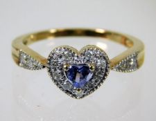 A 9ct gold ring with diamond & tanzanite on a hear