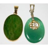 A yellow metal mounted jade pendant twinned with a