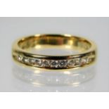 An 18ct gold half eternity ring set with diamond s