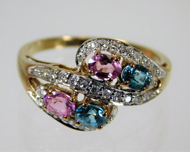 A 9ct gold ring set with diamond, zircon & pink sa