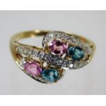 A 9ct gold ring set with diamond, zircon & pink sa