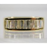 An 18ct gold ring set with approx. 1ct tapered baguette diamonds size L 6.1g