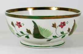 A c.1800 creamware style bowl with painted decor