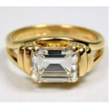 An impressive 18ct gold mounted art deco style ring set with approx. 3.25ct emerald cut diamond of g