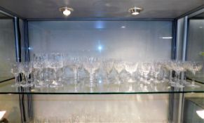 A quantity of cut glass crystal mostly drinking gl
