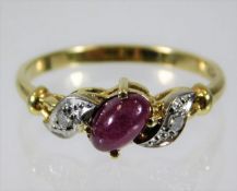 A 14ct gold ring set with diamond & ruby 2.1g size