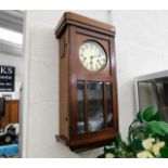 An oak 1930's wall clock 27in high