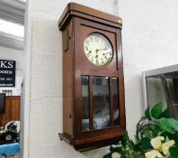 An oak 1930's wall clock 27in high