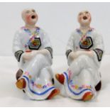 A pair of Tibetan style porcelain monks as incense