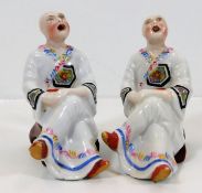A pair of Tibetan style porcelain monks as incense