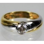 An 18ct two colour gold ring set with approx. 0.6c