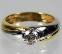 An 18ct two colour gold ring set with approx. 0.6c