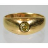 A yellow metal ring, tests as 18ct gold, set with