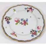 An 18thC. soft paste porcelain plate with basket w