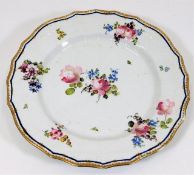 An 18thC. soft paste porcelain plate with basket w
