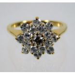 An 18ct diamond cluster ring with fancy yellow centre diamond & approx. 0.72ct of white diamonds 4.6