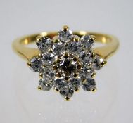 An 18ct diamond cluster ring with fancy yellow centre diamond & approx. 0.72ct of white diamonds 4.6