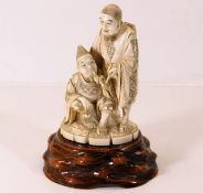 A 19thC. Japanese ivory carving including stand, f