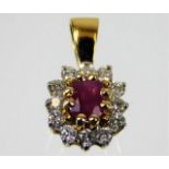 An 18ct gold pendant set with ruby & diamond 1.8g