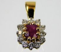 An 18ct gold pendant set with ruby & diamond 1.8g