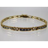 A 9ct gold diamond & sapphire bracelet 10.4g