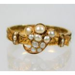 A 19thC. yellow metal memorial ring, tests as 18ct gold, set with pearl setting & shank set with bra