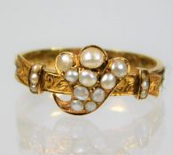 A 19thC. yellow metal memorial ring, tests as 18ct gold, set with pearl setting & shank set with bra