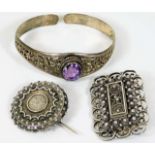 A decorative silver bangle set with amethyst style