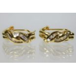 A pair of 14ct gold D shaped earrings set with baguette stones 5.5g