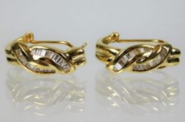 A pair of 14ct gold D shaped earrings set with baguette stones 5.5g