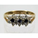 A 9ct gold ring set with sapphire in floral form 1.5g size K/L