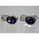 A pair of 18ct gold earrings set with amethyst & white stones 4g